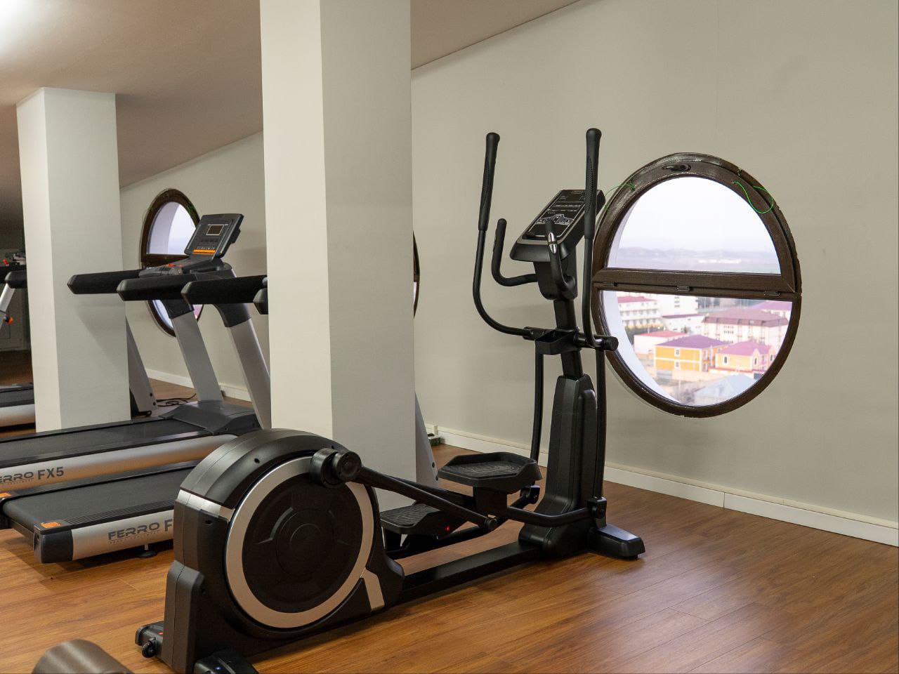 Top-floor fitness room with panoramic views